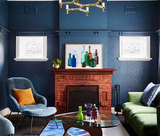 An image of a beautifully designed room with blue and green accents. Art to Art has been involved in the interior project as part of their art services.